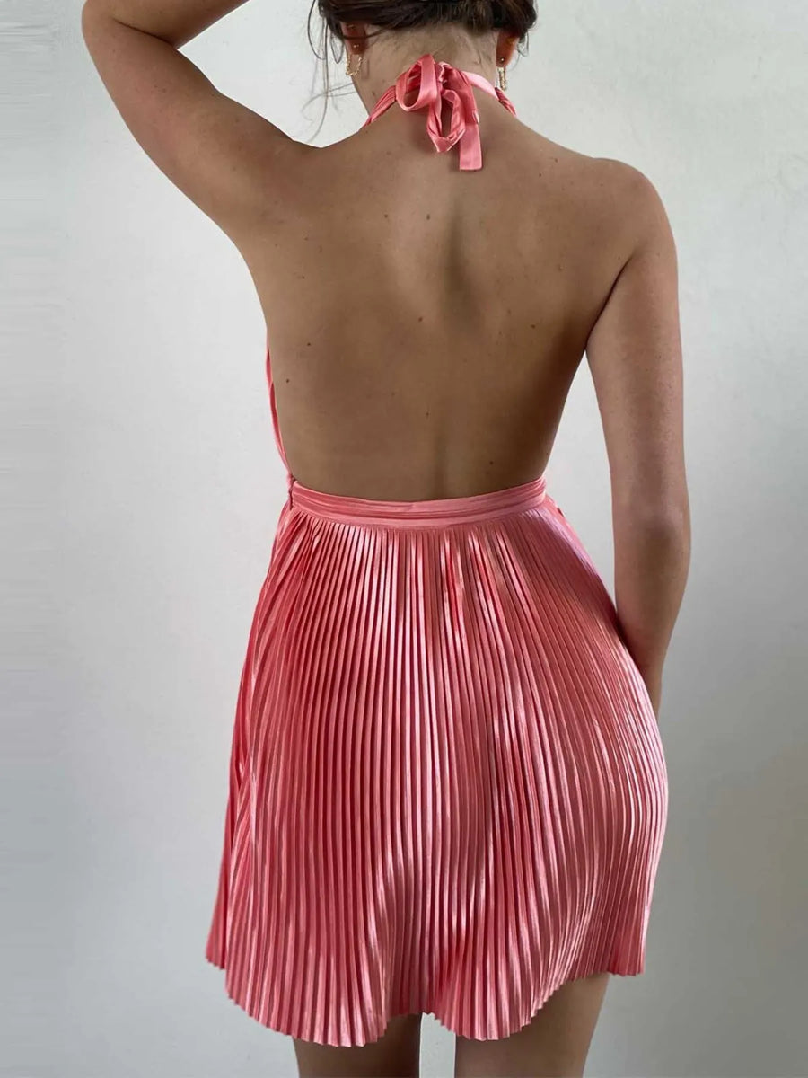 Back view of Babe Beachwaer pleated halter mini cocktail dress in pink with open back design
