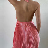 Back view of Babe Beachwaer pleated halter mini cocktail dress in pink with open back design