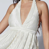 White pleated halter mini cocktail dress by Babe Beachwear with deep V neckline and flowing skirt
