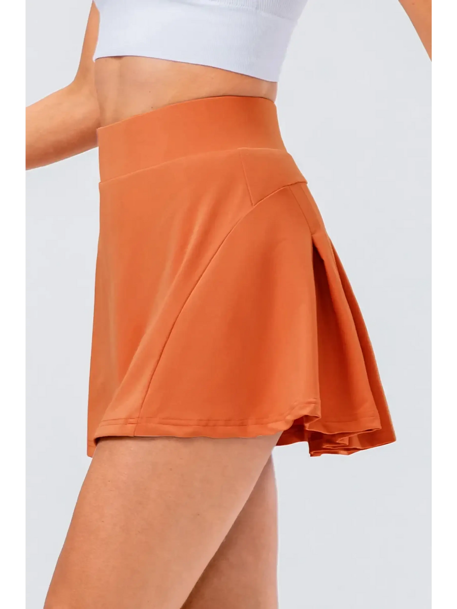 Babe Beachwear pleated tennis skirt with pockets in burnt orange and high waist design