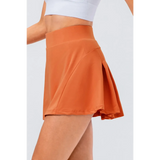 Babe Beachwear pleated tennis skirt with pockets in burnt orange and high waist design