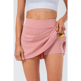 Babe Beachwear pink pleated tennis skirt with pockets designed for comfort and convenience