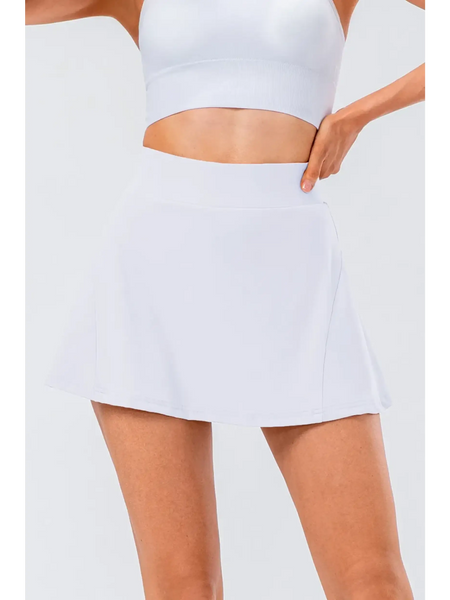 Babe Beachwear pleated tennis skirt with pockets in white modeled with white crop top