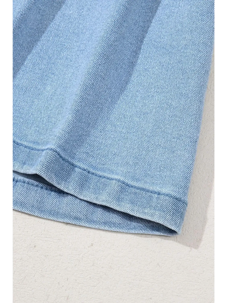 Close-up of light blue pleated wide leg denim shorts hem by Trendsi showing fabric texture