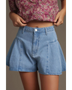 Trendsi pleated wide leg denim shorts in light blue worn with a floral button-up shirt