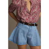 Trendsi pleated wide leg denim shorts in light blue worn with a floral blouse and brown belt