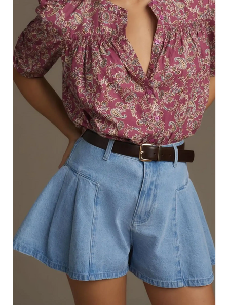 Trendsi pleated wide leg denim shorts in light blue worn with a floral blouse and brown belt