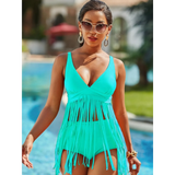 Beach Babes plus size fringe swim dress in turquoise blue with V-neck and long fringes by the pool