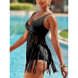 Beach Babes plus size fringe swim dress in black worn by a woman by the pool