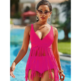 Beach Babes plus size fringe swim dress in bright pink with V-neck and long fringe details by the pool
