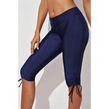Beach Babes plus size swim pants in navy blue with adjustable ruched sides for comfortable fit