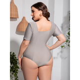 Beach Babes plus size swimsuit with sleeves in light gray shown from back on model back view 
