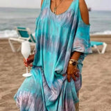 Trendsi plus size tie dye maxi dress in blue and purple with cold shoulder design worn at the beach