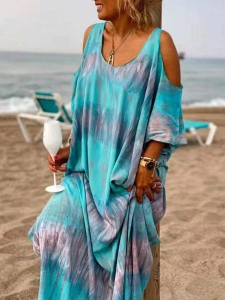 Trendsi plus size tie dye maxi dress in blue and purple with cold shoulder design worn at the beach