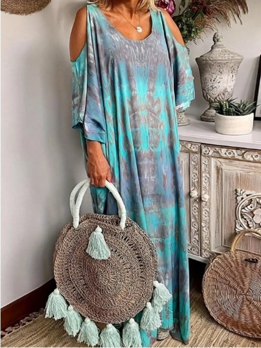 Trendsi plus size tie dye maxi dress in blue and gray with cold shoulder design and round rattan tassel bag