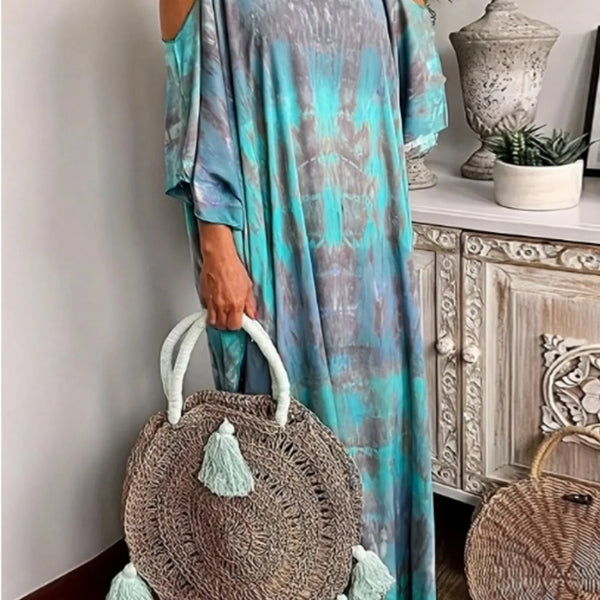 Trendsi plus size tie dye maxi dress in blue and gray with cold shoulder design and round rattan tassel bag