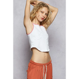 Trendsi white tank top with pink trim sleeveless top worn by woman with casual orange pants