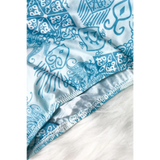 Close-up of Beach Babes sun protective swimwear for women with blue and white intricate pattern