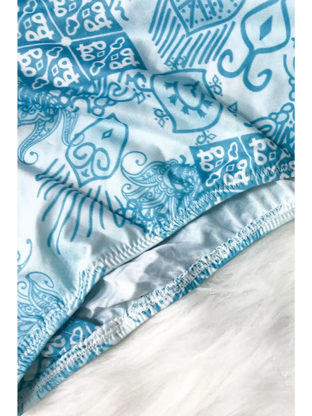 Close-up of Beach Babes sun protective swimwear for women with blue and white intricate pattern