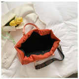 Babe Beachwear Puffer Tote Bag With Shoulder Straps in orange with spacious interior and patterned strap