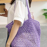 Miss Sparkling purple braided net beach tote bag carried by woman in white shirt holding coffee cup