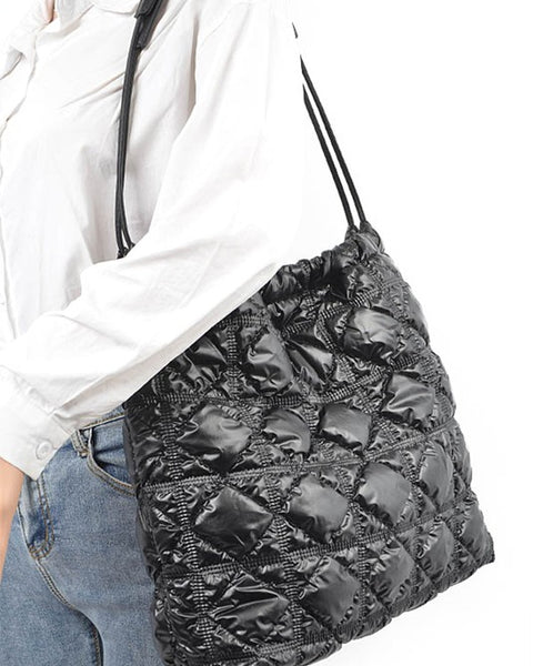 Babe Beachwear Quilted Designer Style Puffer Tote black bag worn over shoulder with quilted pattern
