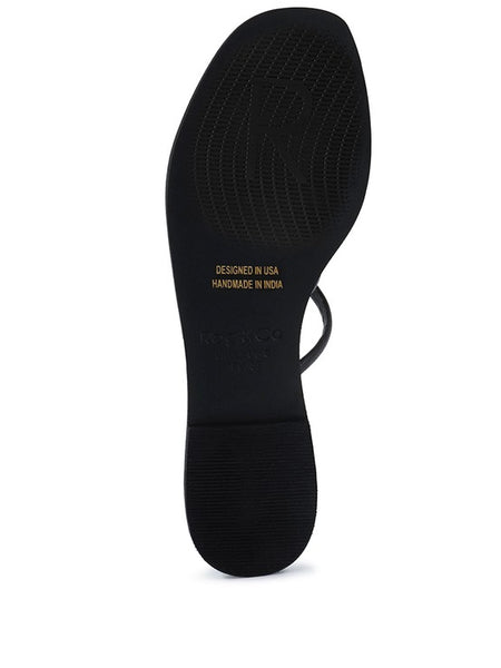 Black sole view of Babe Beachwear chic metallic flat slip-ons sandals with textured grip