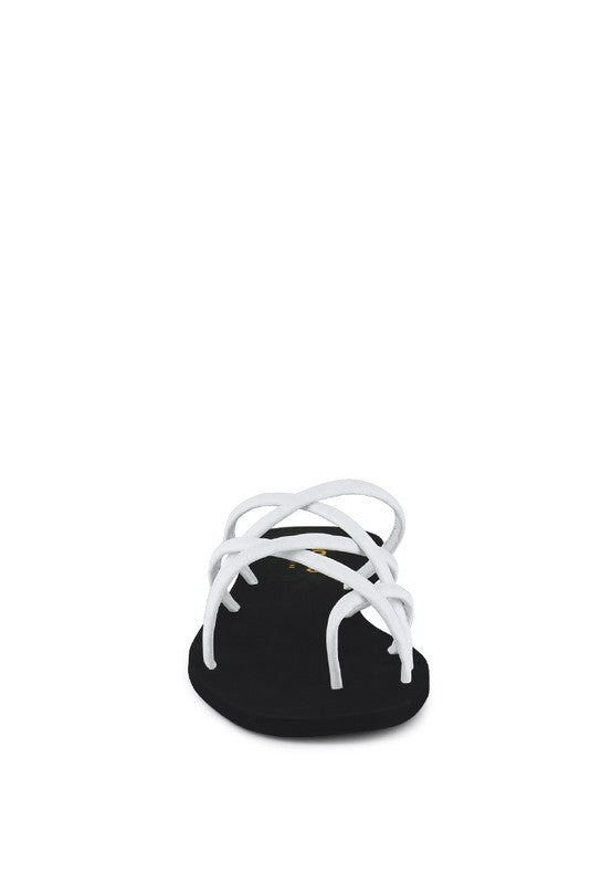 Babe Beachwear chic metallic flat slip-ons with white crisscross straps and black sole