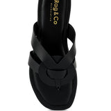 Black women's summer slip-on sandals flat with wide crisscross straps and circular detail