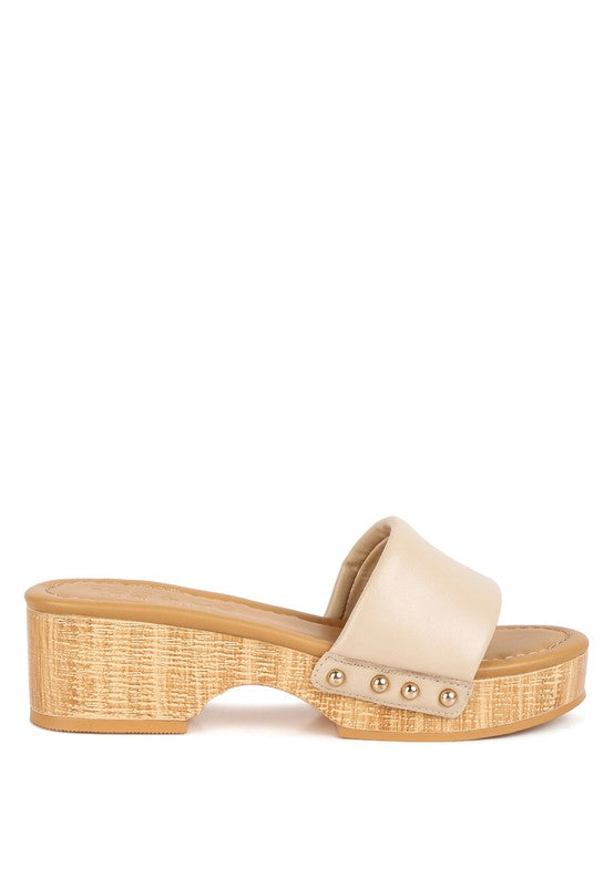 Rag Company beige clog wooden sandals with studded straps and textured wooden platform heel