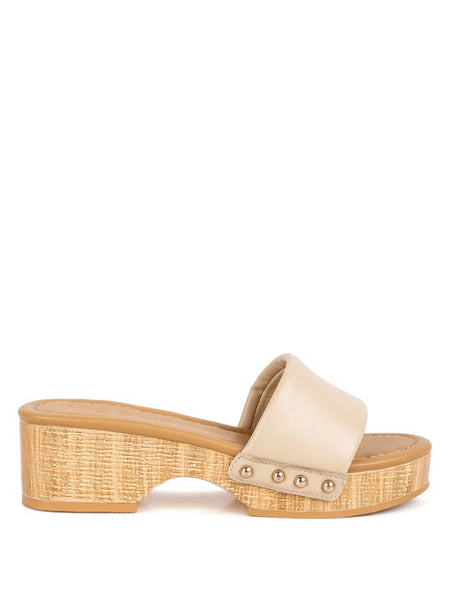Rag Company beige clog wooden sandals with studded straps and textured wooden platform heel