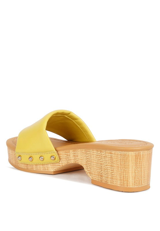 Rag Company yellow clog wooden sandals with a low wooden heel and studded strap