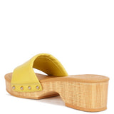 Rag Company yellow clog wooden sandals with a low wooden heel and studded strap