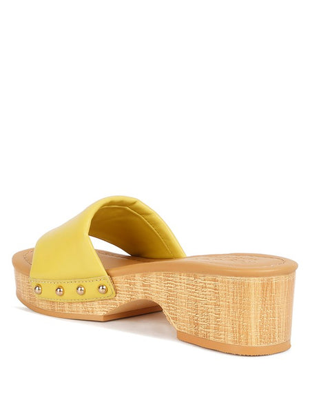 Rag Company yellow clog wooden sandals with a low wooden heel and studded strap
