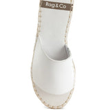 White slip-on summer sandals with stitched sole and open toe design by Babe Beachwear