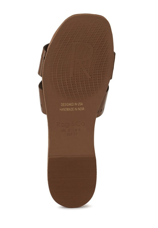Brown sole of women's slip-on beach sandals by Babe Beachwear showing textured grip and branding