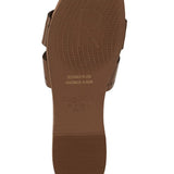 Brown sole of women's slip-on beach sandals by Babe Beachwear showing textured grip and branding