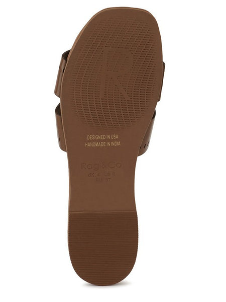 Brown sole of women's slip-on beach sandals by Babe Beachwear showing textured grip and branding