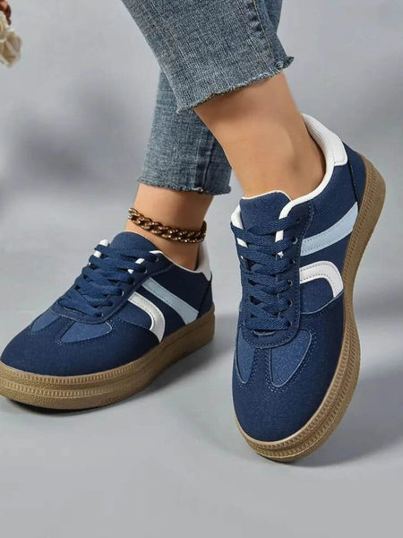Trendsi red contrast round toe sneakers styled with casual denim jeans and ankle bracelet