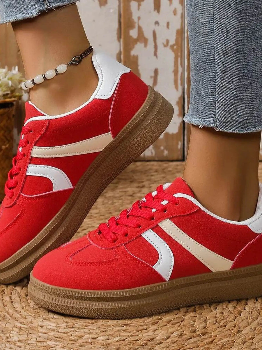 Trendsi red contrast round toe sneakers with white stripes and brown sole worn with jeans