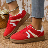 Trendsi red contrast round toe sneakers with white stripes and brown sole worn with jeans