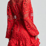 Red lace mini dress by Babe Beachwear featuring intricate cutout patterns and ruffled hem