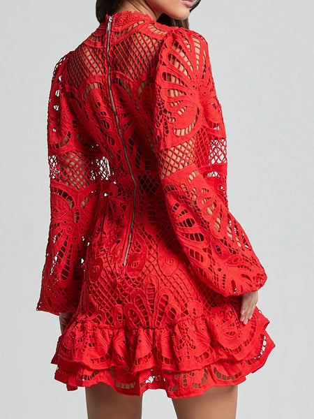 Red lace mini dress by Babe Beachwear featuring intricate cutout patterns and ruffled hem