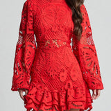 Babe Beachwear white lace mini cocktail dress featuring long sleeves and intricate lace detailing