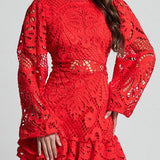 Red lace mini dress by Babe Beachwear featuring intricate patterns and long bell sleeves