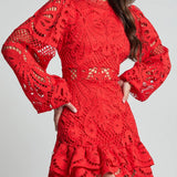 Red lace mini dress with long sleeves and ruffled hem by Babe Beachwaer detailed design