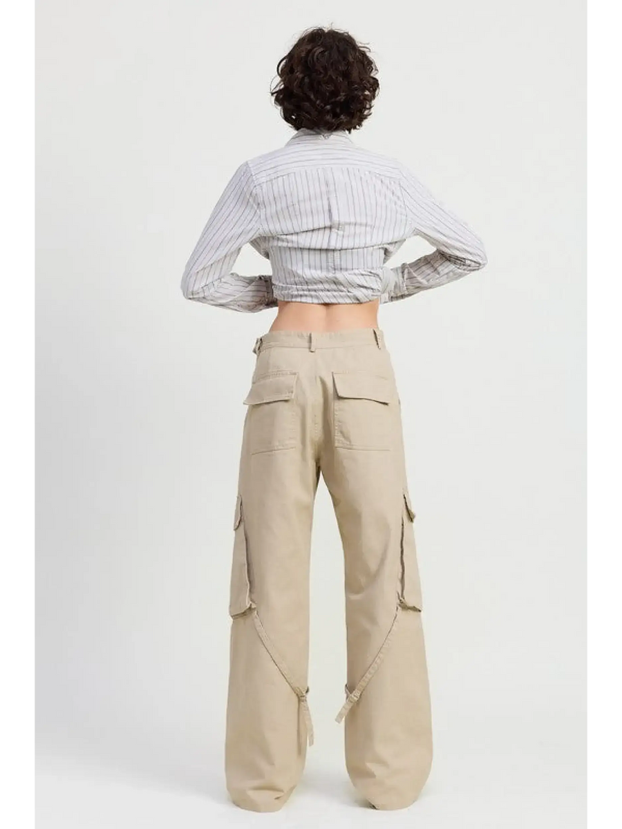 Back view of relaxed cargo pants for women by Emory Park in beige with multiple pockets and loose fit