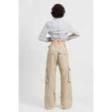 Back view of relaxed cargo pants for women by Emory Park in beige with multiple pockets and loose fit