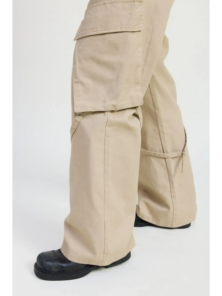 Beige relaxed cargo pants for women by Emory Park styled with black shoes