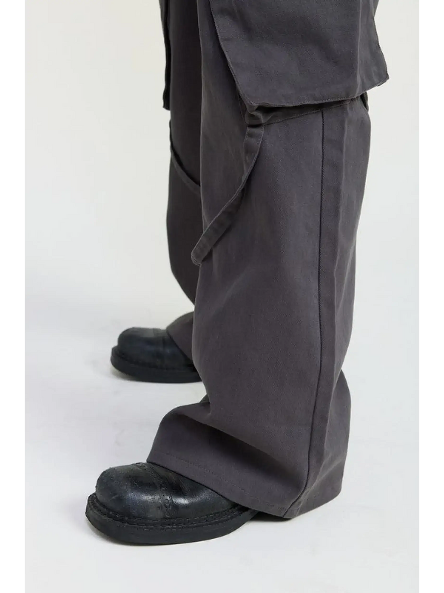 Emory Park dark gray relaxed cargo pants for women paired with black shoes showing loose fit and pocket detail